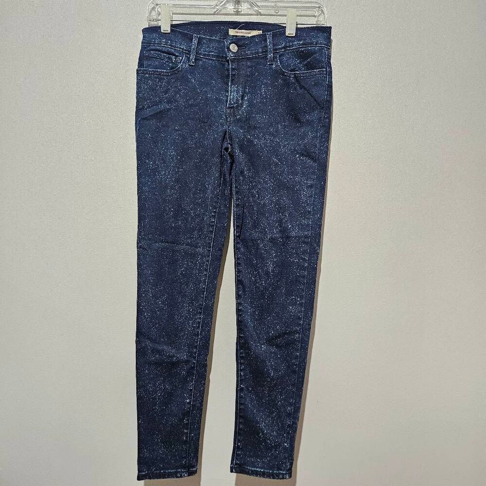 These appear to be Levi's 710 Super Skinny jeans in a dark blue speckled or blea